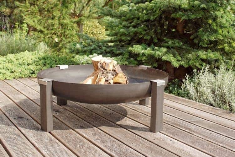 An image of a fire pit bowl on a wood deck without a deckprotect fire pit pad