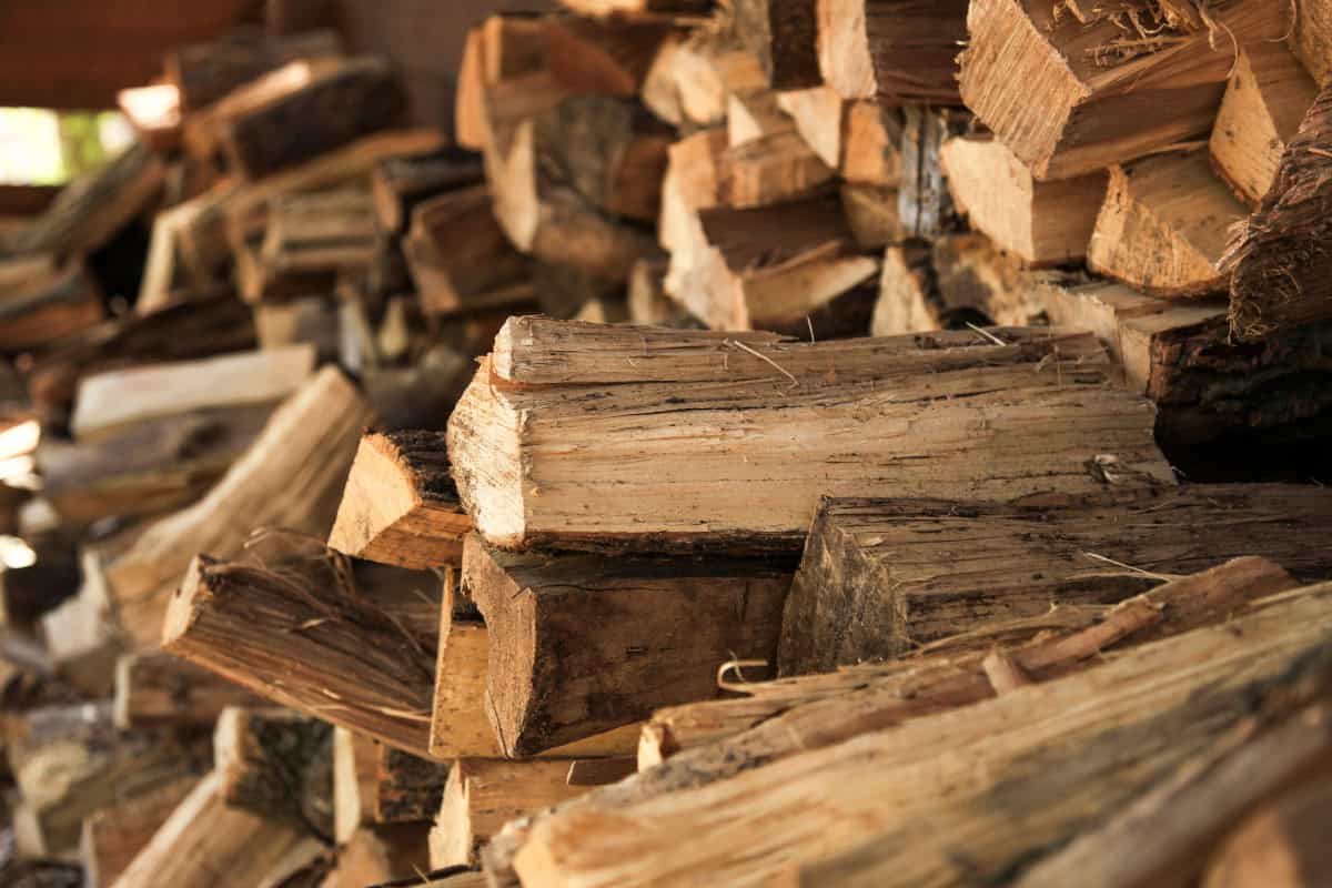 how-to-start-a-fire-pit-faqs Image of a stack of firewood.