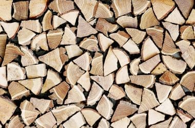 Image of stacked firewood for a blog post covering kiln-dried-firewood for fire pits.