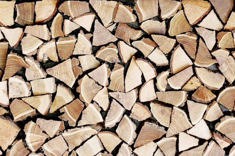 Image of stacked firewood for a blog post covering kiln-dried-firewood for fire pits.