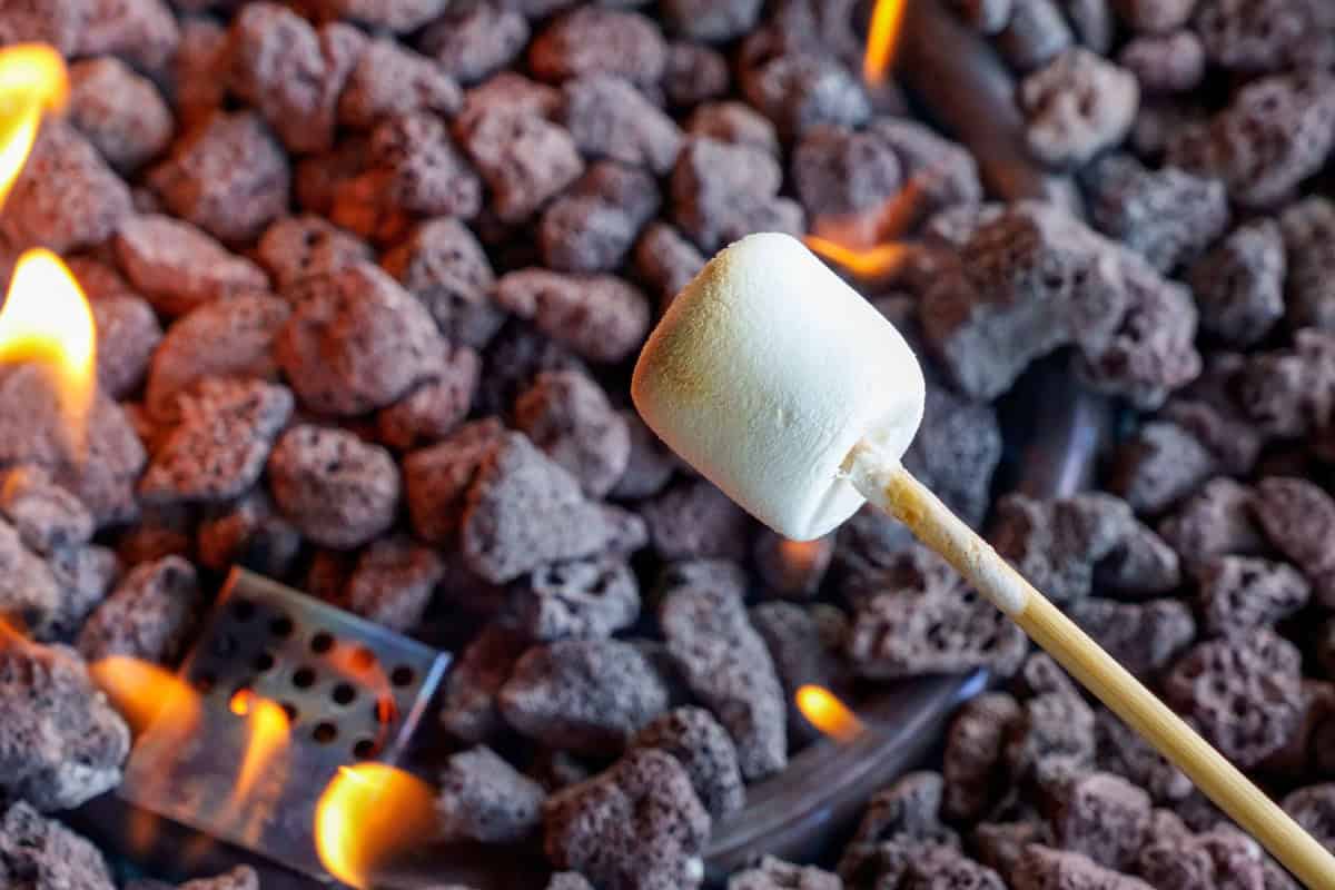 Image of marshmallows roasting for a blog post about roasting marshmallows over a gas fire pit.