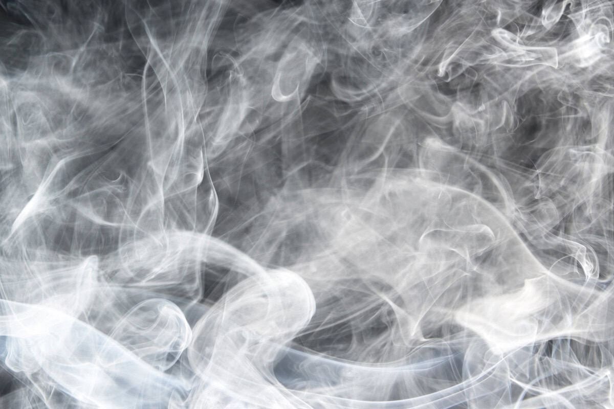 will-a-fire-pit-repel-mosquitoes-science Image of white smoke with a black background.