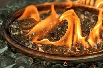 Image of a gas fire pit burner and fireglass