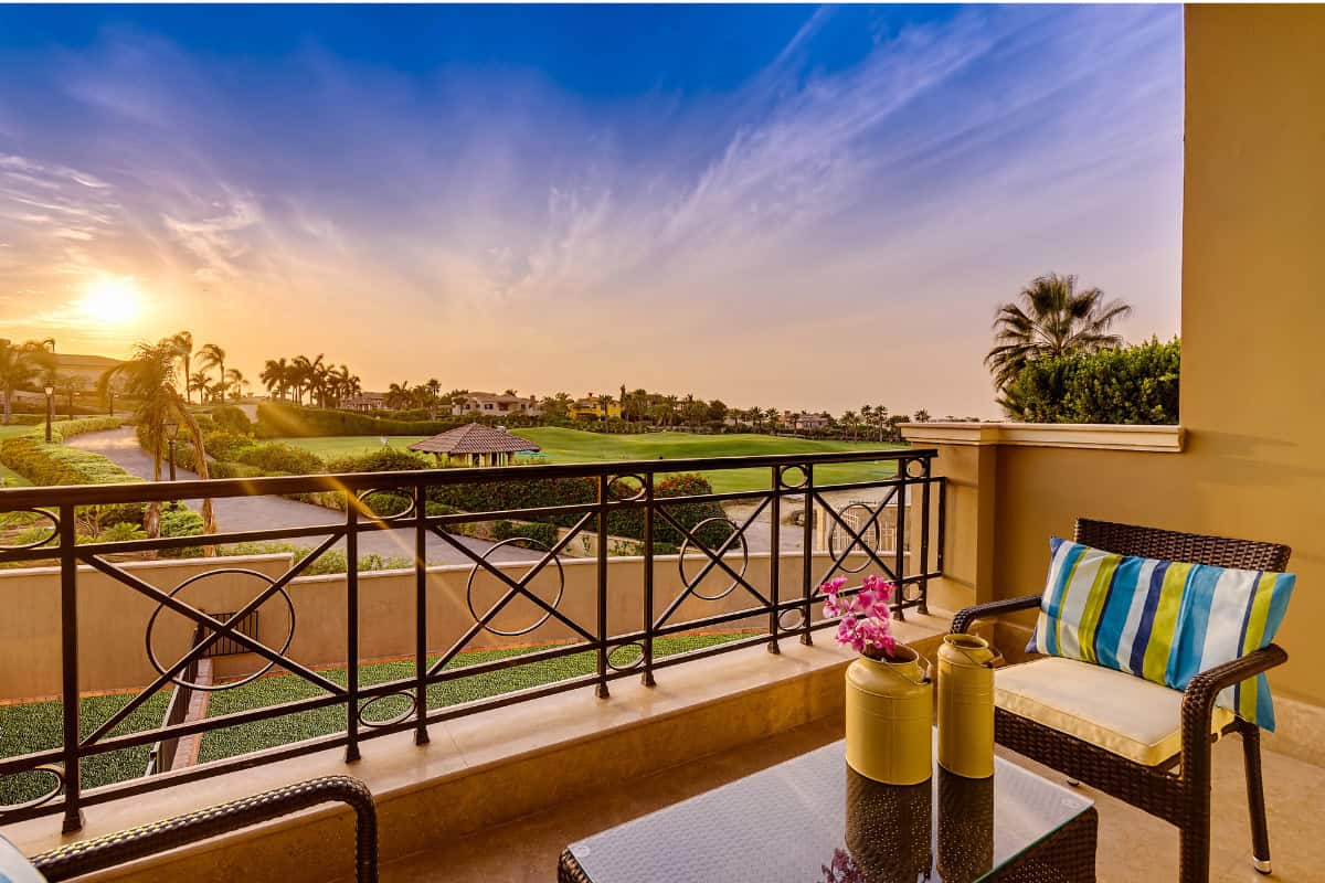 Image of condo balcony overlooking a golf course.