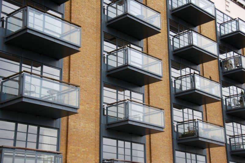 Image of apartment balconies for a blog post covering using a fire pit on a balcony.