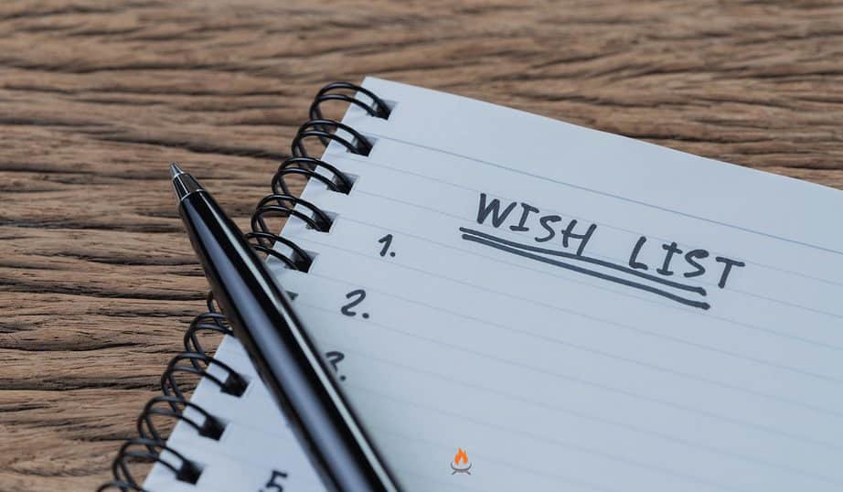 Image of person writing fire pit wish list items