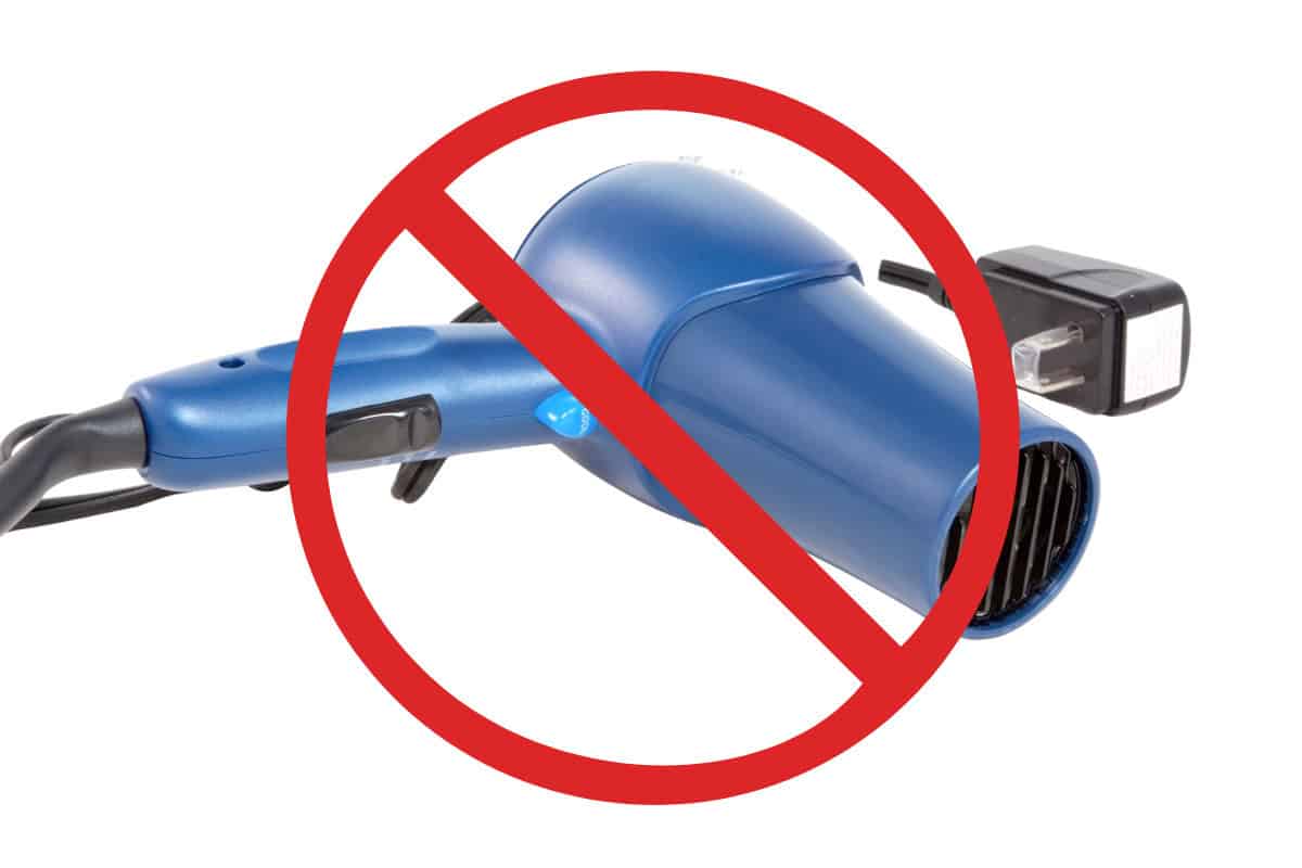 Image of a hair dryer crossed out for a blog post explaining wht to do if a Solo Stove gets rained on.