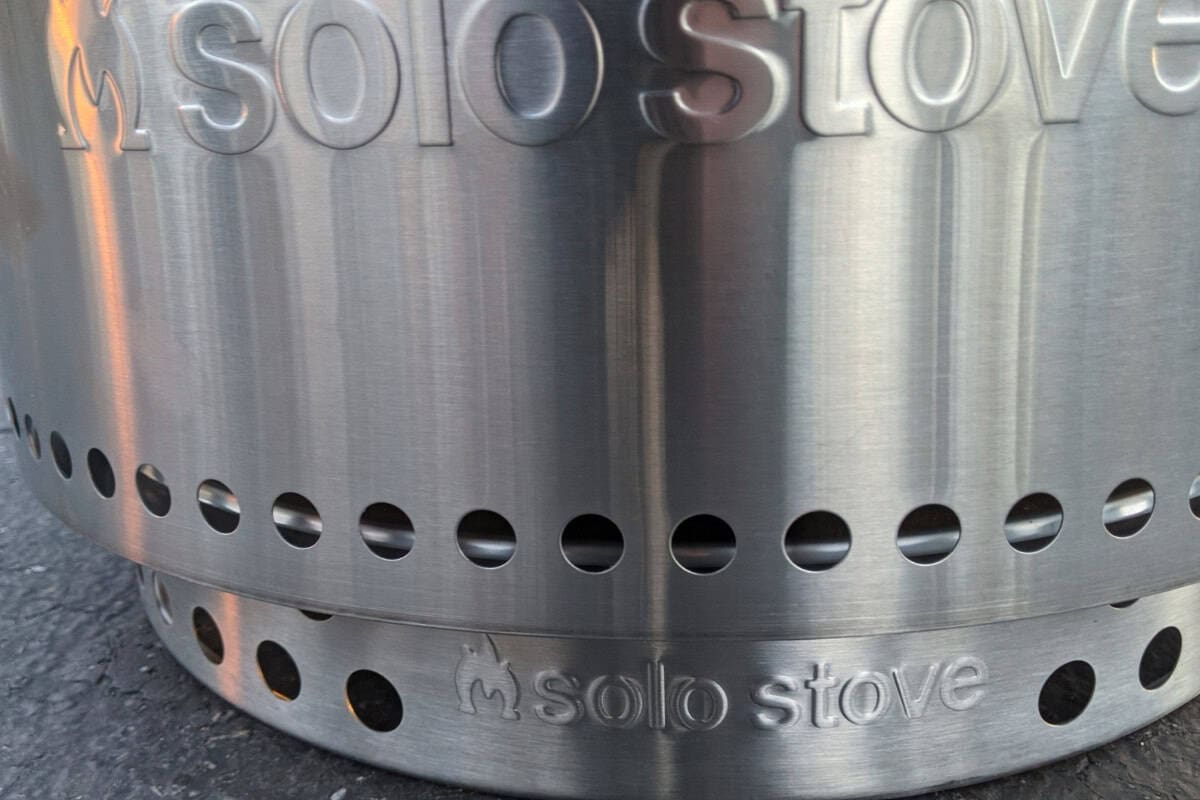 Image of the front of a fire pit sitting on its base.