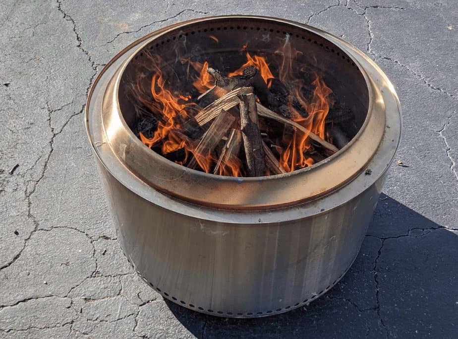 Image of a fire pit on a cracked driveway