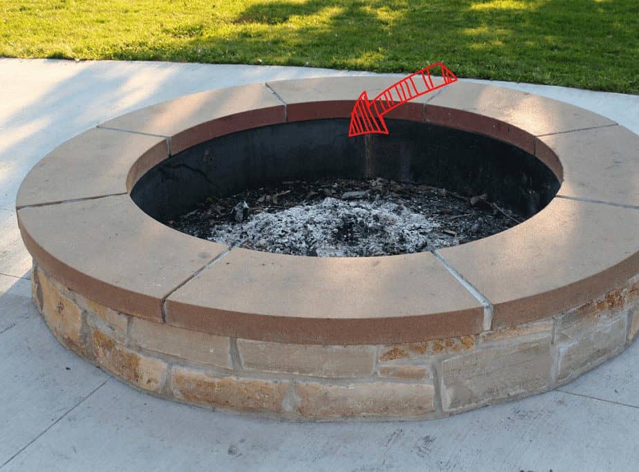 Image of a large fire pit insert in a fire pit round