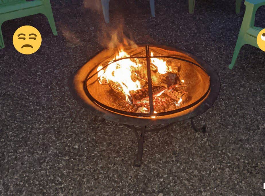 Image a traditional fire pit burning at night