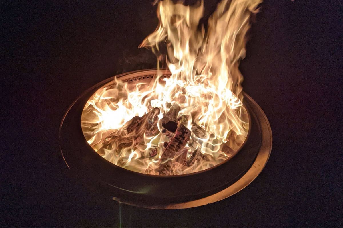 Image of a Solo Stove Bonfire at night.