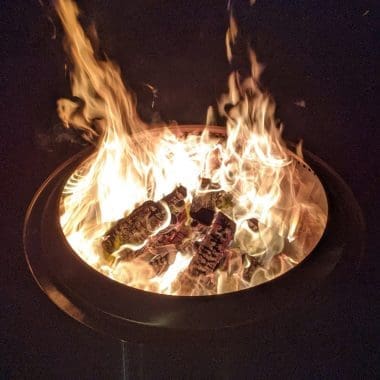 Image of a non-smoking Solo Stove fire pit at night for a blog post about Solo Stove smoking.