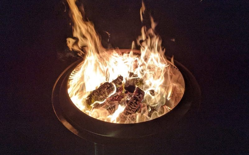 Image of a non-smoking Solo Stove fire pit at night for a blog post about Solo Stove smoking.