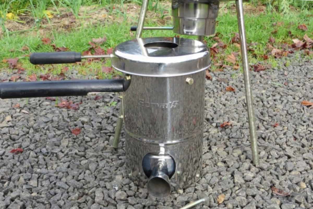 Image of a TLUD stove on a gravel drive for a blog post about Solo Stove smoking.