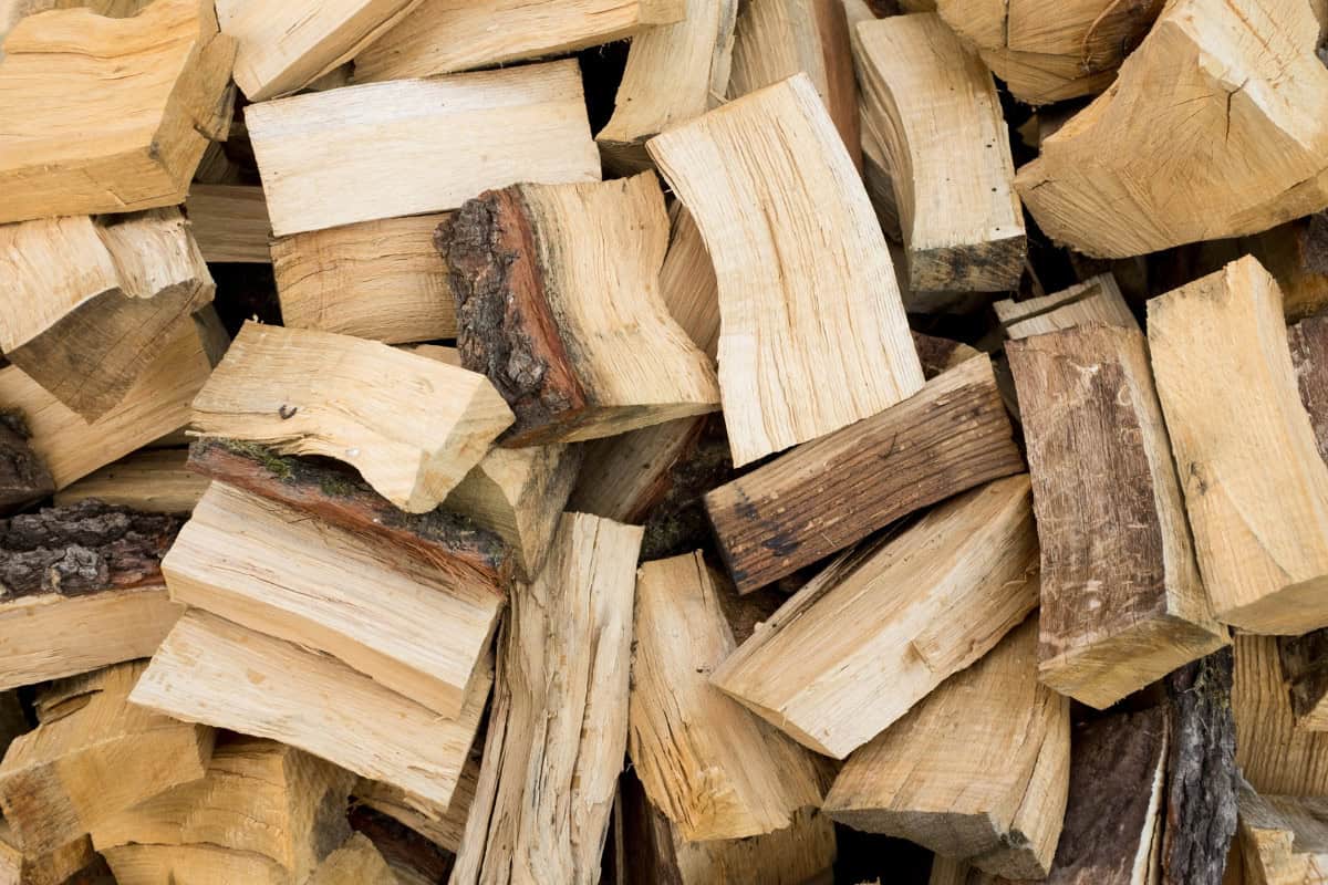Image of a stack of freshly chopped beech firewood for a blog post covering seasoned firewood.