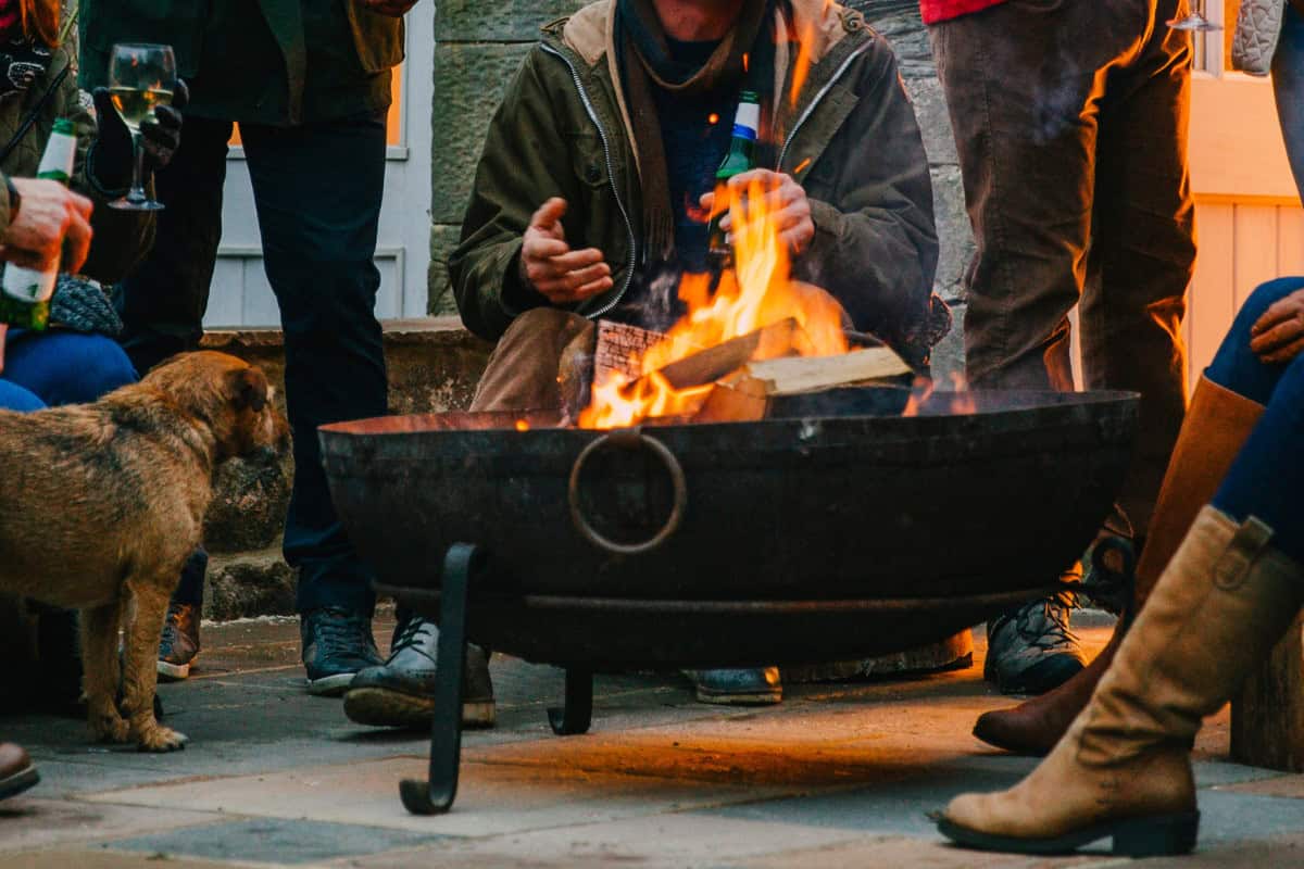 Image of an evening gathering around the fire pit.