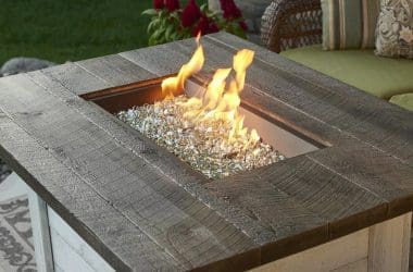 Image of a burning rectangular propane fire pit for a blog post about gas fire pit whistles.