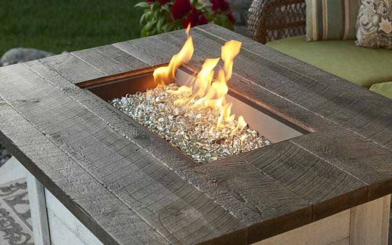 Image of a burning rectangular propane fire pit for a blog post about gas fire pit whistles.