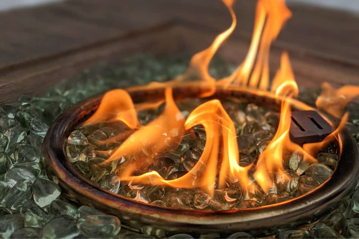 Image of a lit propane fire pit burner for a blog post about gas fire pit whistles.