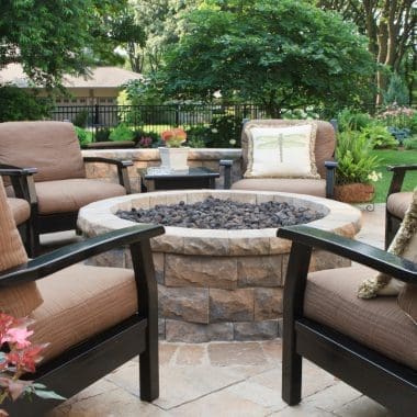 Image of an outdoor fire pit round for a blog post answering the question "how many fire pit bricks do I need?"