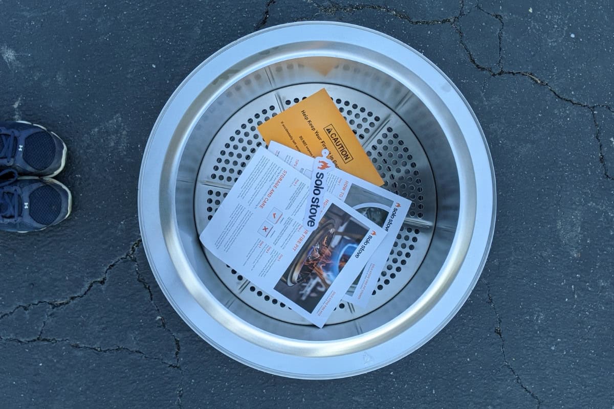 High-quality backyard fire pit with safety instructions and assembly guide, perfect for outdoor heating and social gatherings.