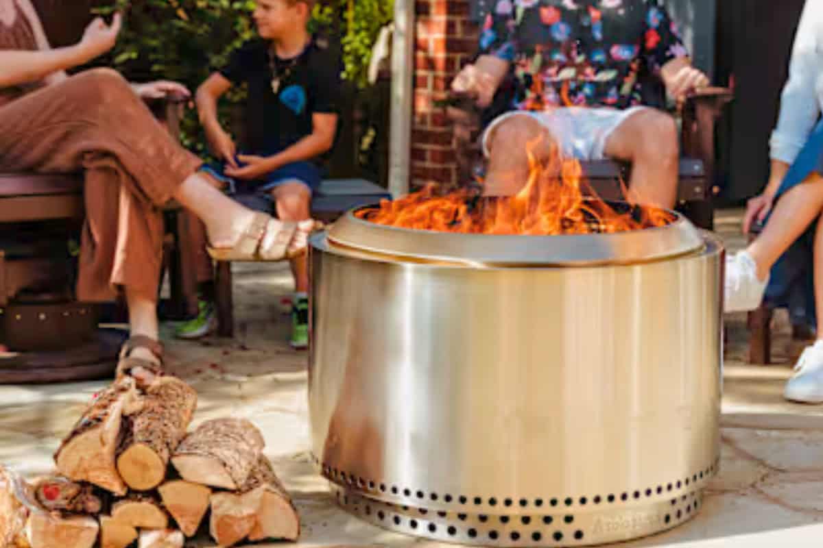 Cozy backyard gathering with a backyard toasty fire pit surrounded by family and friends on a warm evening.
