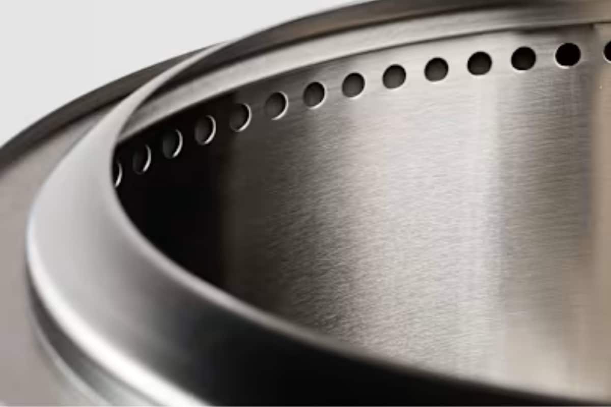 Shiny stainless steel toaster with close-up view, highlighting its modern design and sleek finish.