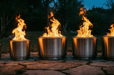Image of a row of Solo Stove fire pits burning at dusk for a blog post that answers the question, "what size Solo Stove should I buy?"