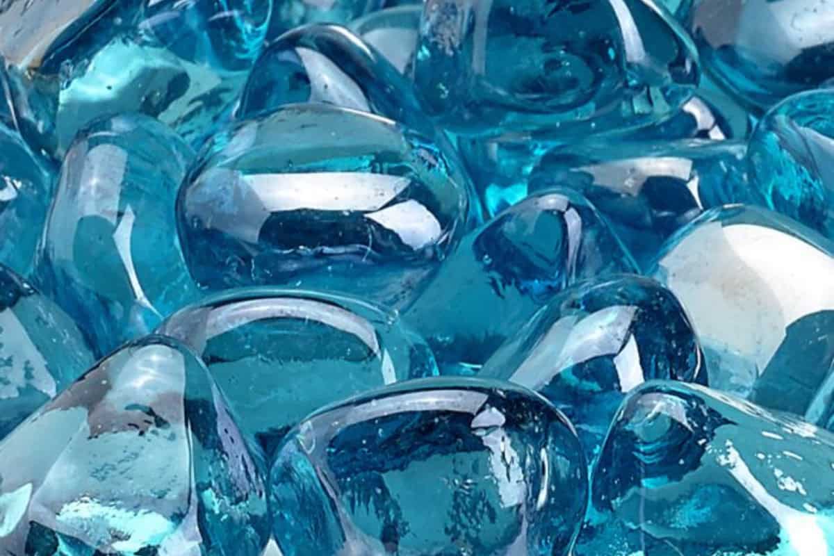 Image of a pile of shiny blue fire glass.