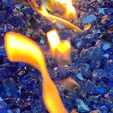 Image of blue fire glass in a fire pit for a blog pit on how to clean fire glass.