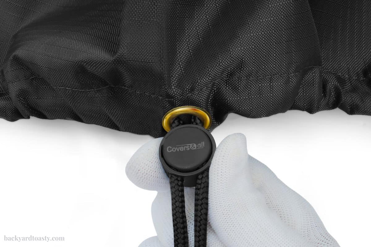 Image of a cinch for a fire pit cover.