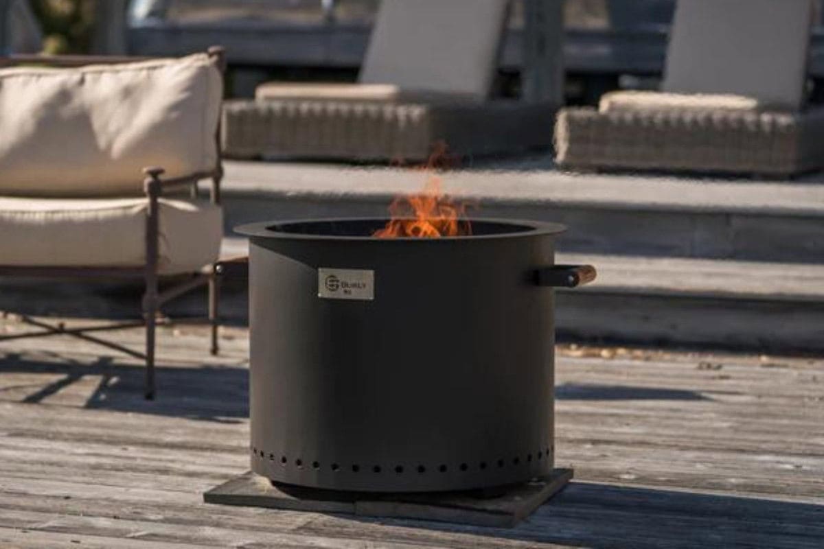 Image of a smokeless fire pit sitting on an urban patio.