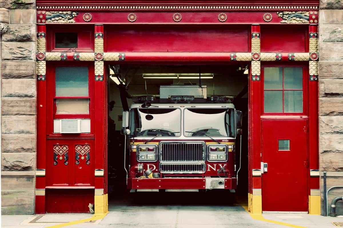 Image of a fire truck inside a city firehouse.