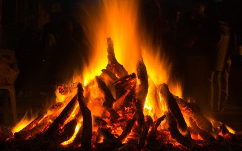 Image of a fire at an fire festival in India for a blog post covering fire pit history.