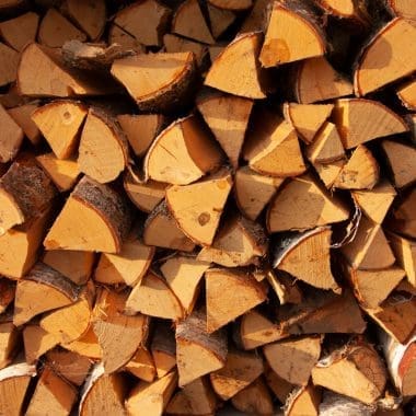 Image of neatly stacked firewood splits for a blog post covering U.S. firewood prices.