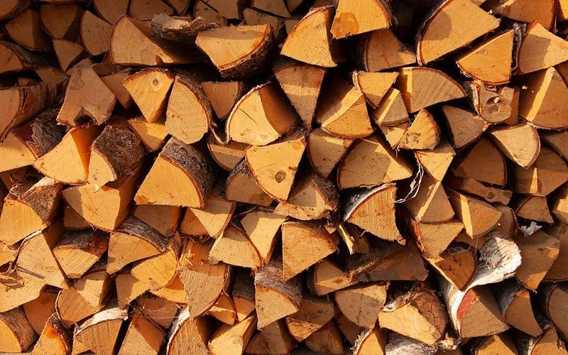 Image of neatly stacked firewood splits for a blog post covering U.S. firewood prices.