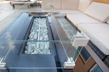 Image of a linear gas fire pit and furniture for a post on how to solve a number of gas fire pit problems.